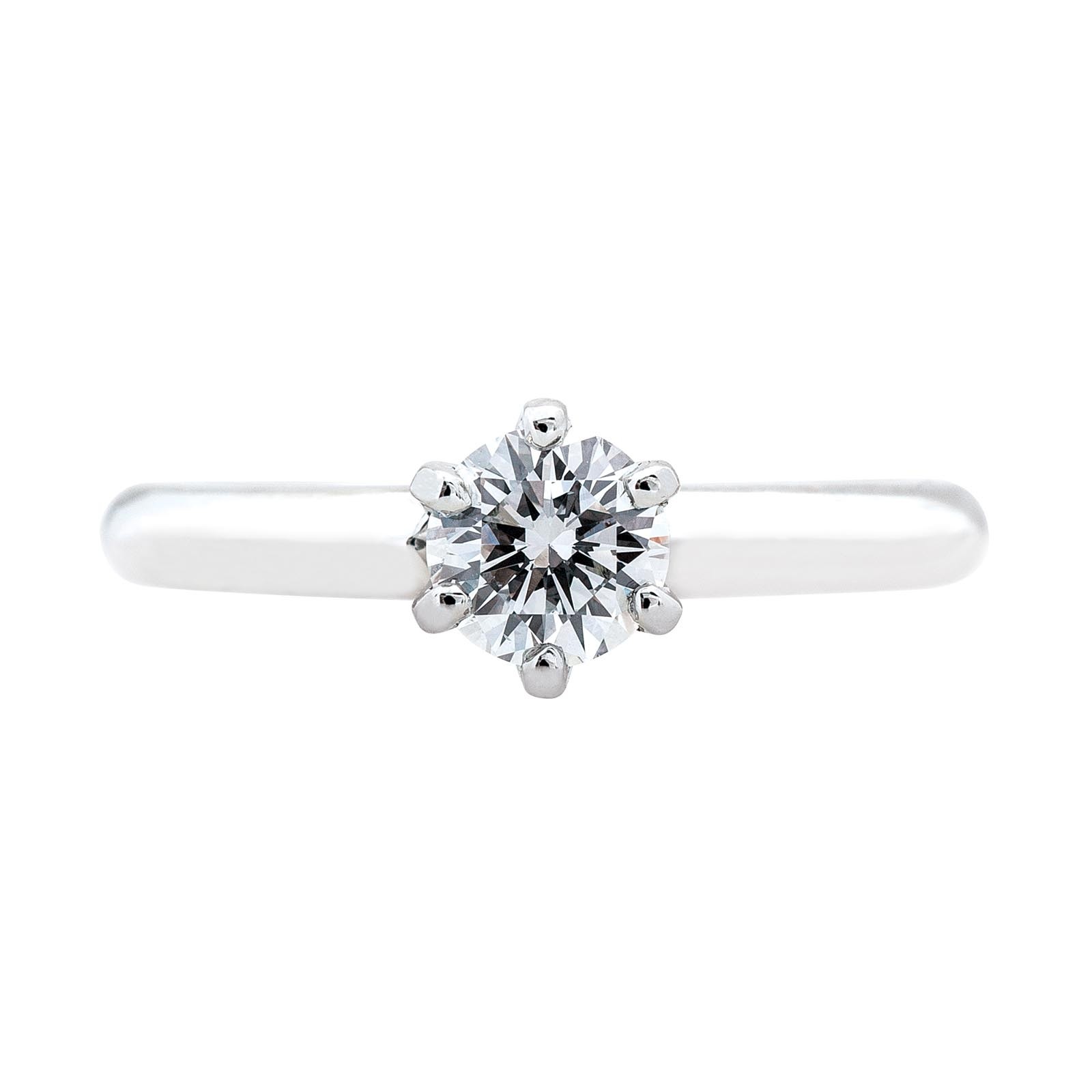 a solitaire diamond ring set in white gold